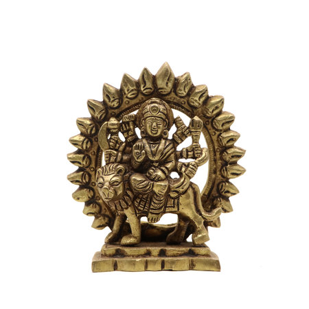 statue of goddess durga devi of hindu religion holding multiple weapons in her many arms, sitting on her lion, handcrafted with details in golden brass isolatedの写真素材