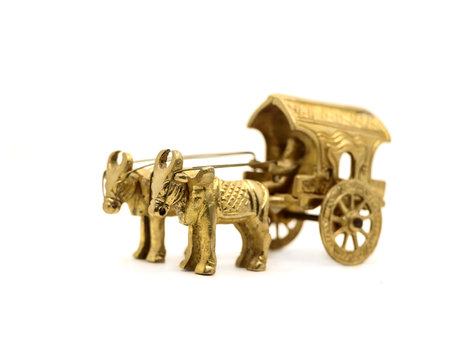 Antique wooden horse-drawn carriage isolated on a white background.の写真素材