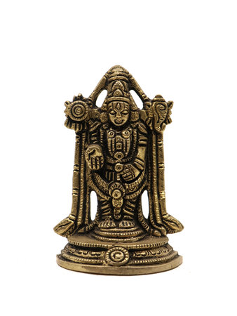 antique tribe idol of worship carved in stone from ancient india isolated in a white backgroundの写真素材