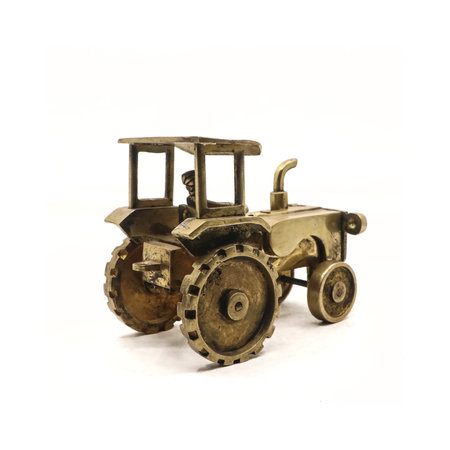 toy model of an old rusty tractor truck used by farmers for agriculture made of golden metal isolated in a white backgroundの写真素材