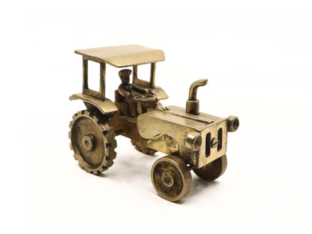 Vintage toy tractor isolated on a white background with clipping path.の写真素材