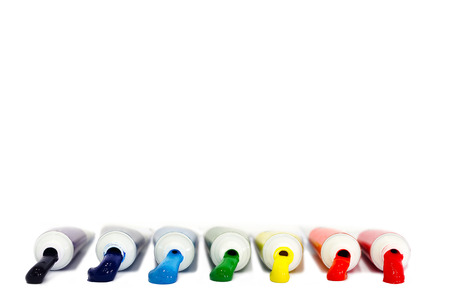 Rainbow paint in tubes on white backgroundの写真素材
