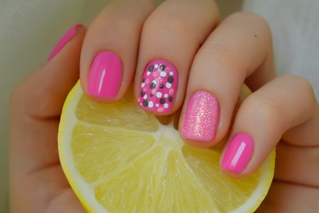 Nict pink nail art with grey and white dots. Photo with lemonの写真素材