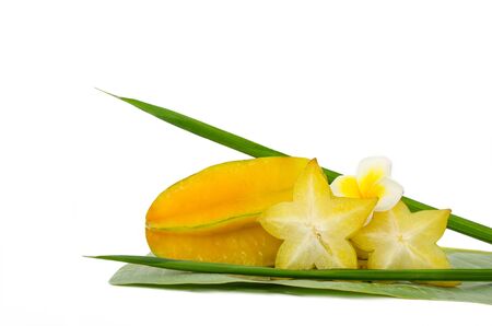 Carambola fruit with green leaf isolated on white backgroundの写真素材