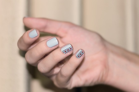 Woman hand with light blue nail designの写真素材