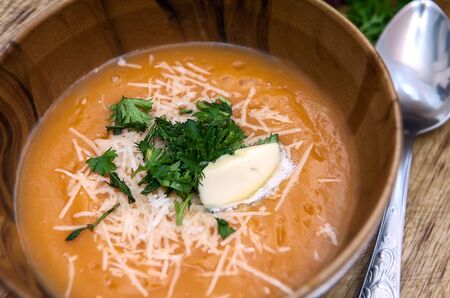 Cream soup with pumpkin, parmesan cheese and herbs.の写真素材