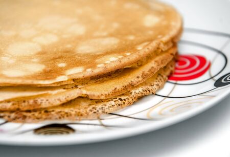 Delicious crepe on big white plate. Close up photo.