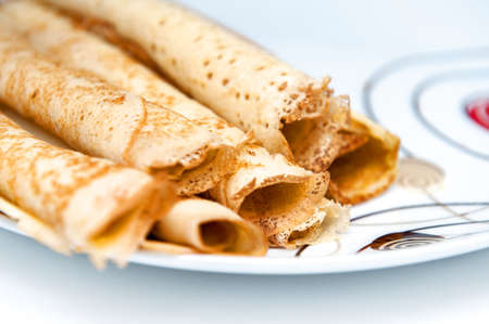 Delicious crepe rolls on big white plate. Close up photo.の写真素材