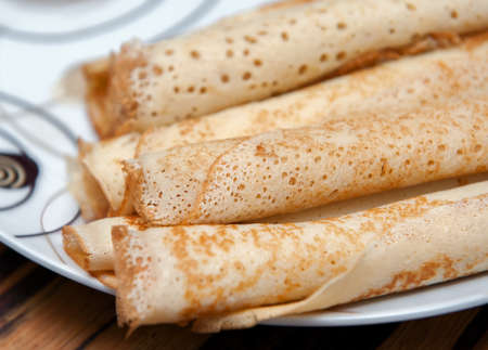 Delicious crepe rolls on big white plate. Close up photo.の写真素材