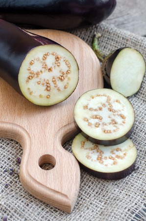 Sliced eggplants on a wooden table. Selective focusの写真素材