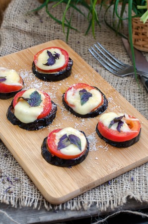 Baked eggplant with tomato, cheese and basil.の写真素材