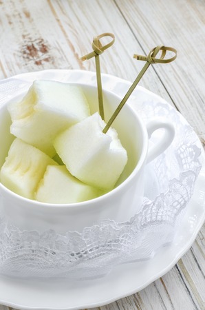 Fresh and tasty sliced melon in white plate.の写真素材