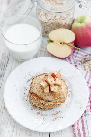 Oatmeal pancakes with apple and honey. Healthy breakfast.の写真素材