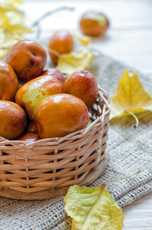 Fresh jujube or chinese date in a small basket.の写真素材
