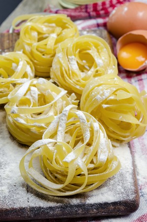 Fresh pasta close up with wheat and eggs.の写真素材