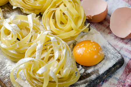 Fresh pasta close up with wheat and eggs.の写真素材