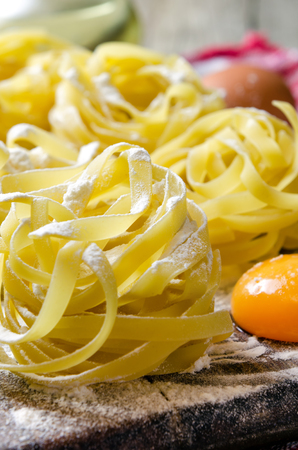 Fresh pasta close up with wheat and eggs.の写真素材