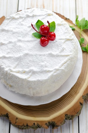 Coconut cake on wooden background. Top view.の写真素材