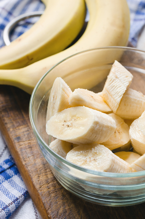 Sliced fresh banana in a glass bowl. Close up.の写真素材
