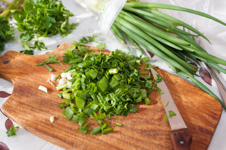 Green herbs. Freshly chopped parsley, dill and green onions.の写真素材