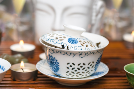 Chinese tea ceremony with candles. Bowl with tea.の写真素材
