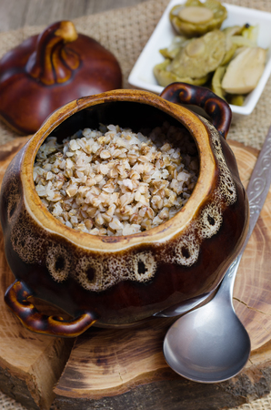 Cooked buckwheat in a brown clay pot.の写真素材