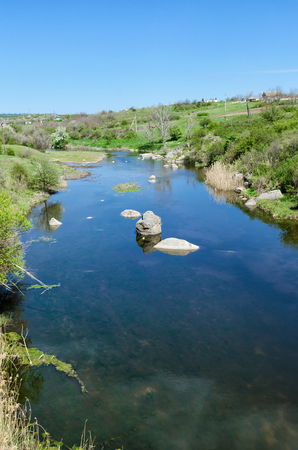 Countryside river landscape in early spring season.の写真素材