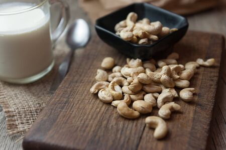 Cashew nut on dark wooden background. Healthy food.の写真素材