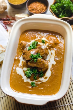 Butter chicken curry with naan. Traditional Indian food.の写真素材