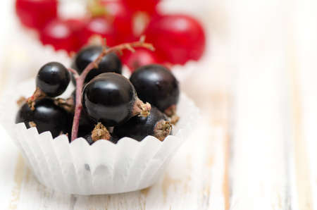 Ripe red and black currants close-up as background.の写真素材