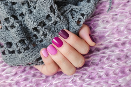 Pink nail design. Beautiful female hand with different shades of pink manicure.の写真素材