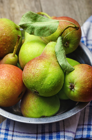 Fresh ripe pears on wooden background, closeup.の写真素材