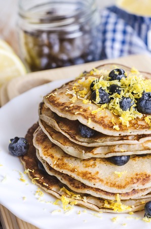 Pancakes with blueberry on white plate on dark background.の写真素材