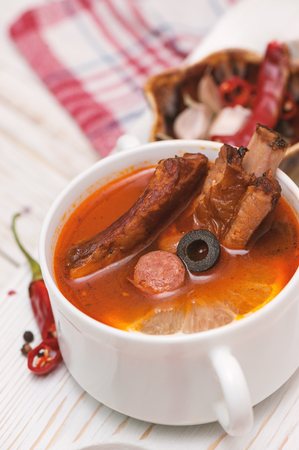 Soup with smoked meat, olives and lemon. Solyanka soup.の写真素材