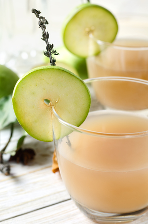 Pear Juice with fresh fruits on white wooden background.の写真素材