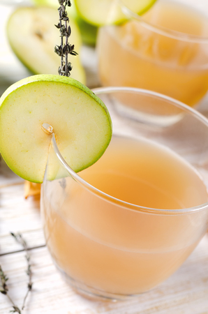 Pear Juice with fresh fruits on white wooden background.の写真素材
