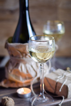 Glass with white wine on romantic Valentines day background.の写真素材
