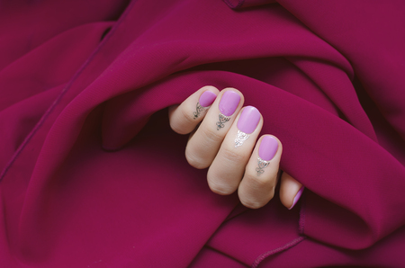 Female hands with beautiful pink nail design.の写真素材