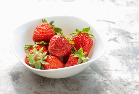 Fresh strawberry in white plate. Close up photo.の写真素材