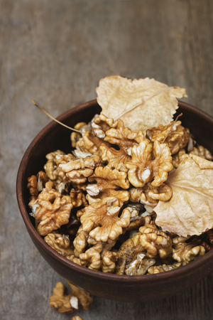 Walnuts kernels on wooden background.の写真素材