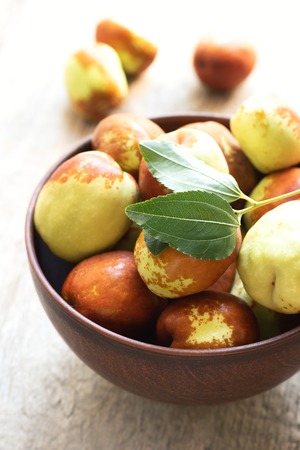 Fresh jujube on wooden table. Unabi fruit.の写真素材