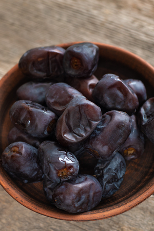 Date fruit on wooden background, close upの写真素材