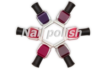Words nail polish and nail polish bottles on background.の写真素材