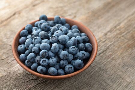 Fresh Blueberry on wooden background, close up.の写真素材