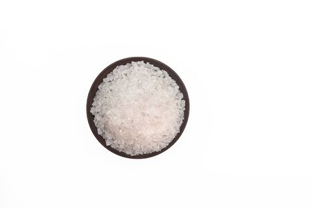 Coarse salt in small bowl on white backgroundの写真素材