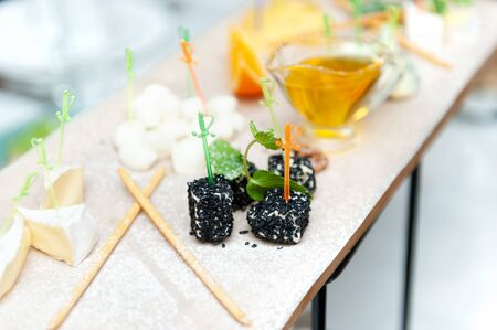 Delicious cheese appetizer with honey on the table.の写真素材