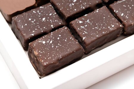 Chocolate candies on a white background, close up