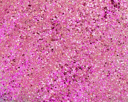 Shiny background with pink glitter close up