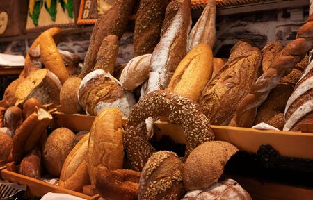 Assortment of fresh baked bread and bread slicesの写真素材
