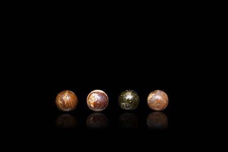Sets of round stones on black background.の写真素材